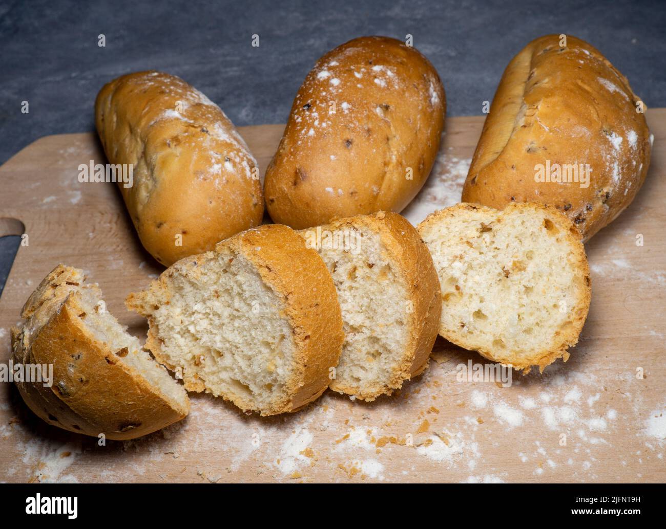 Buns stuffed with onions. Lush flour products. Hearty food. Unhealthy food. At the bakery. cut