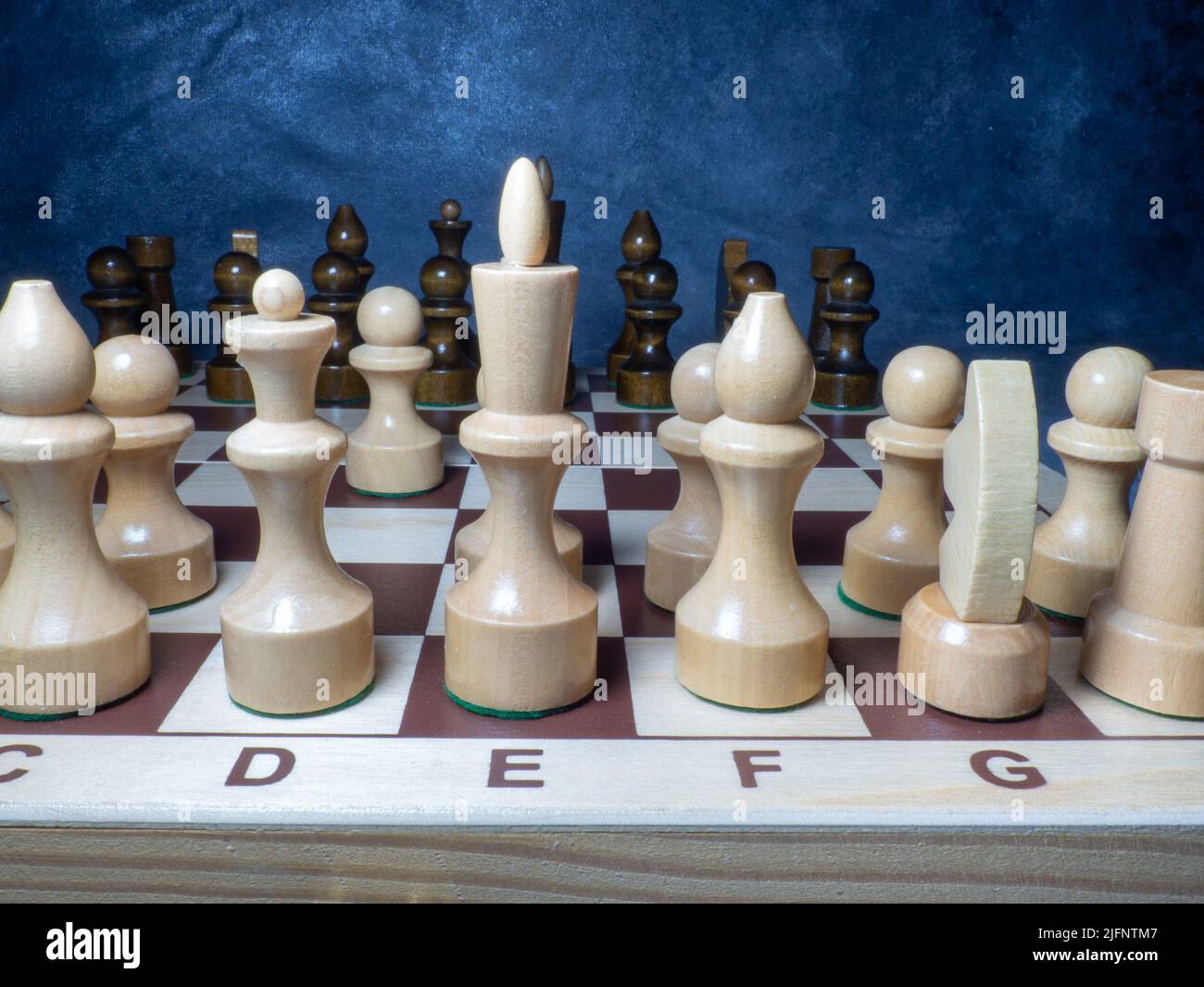 Chess board with figures. Wooden chess. Board games. Location of opponents. Counter strategy