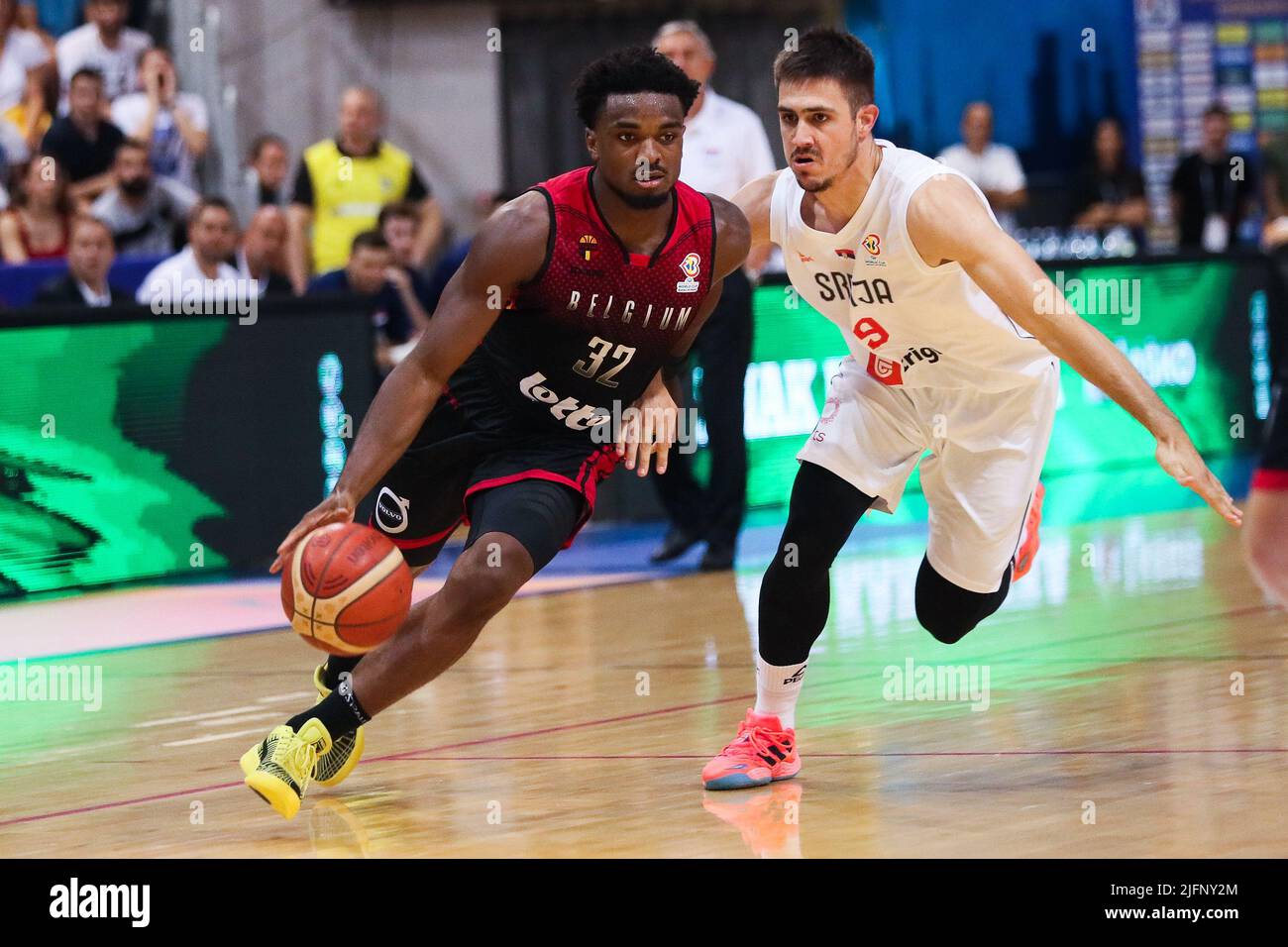 Nis, Serbia, 04/07/2022, Belgium's Retin Obasohan and Serbia's Vanja  Marinkovic fight for the ball during a basketball match between Serbia and  Belgium's national team the Red Lions, Monday 04 July 2022 in