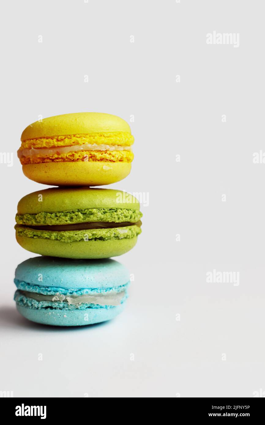 Stack of colorful macaroons on white background Stock Photo