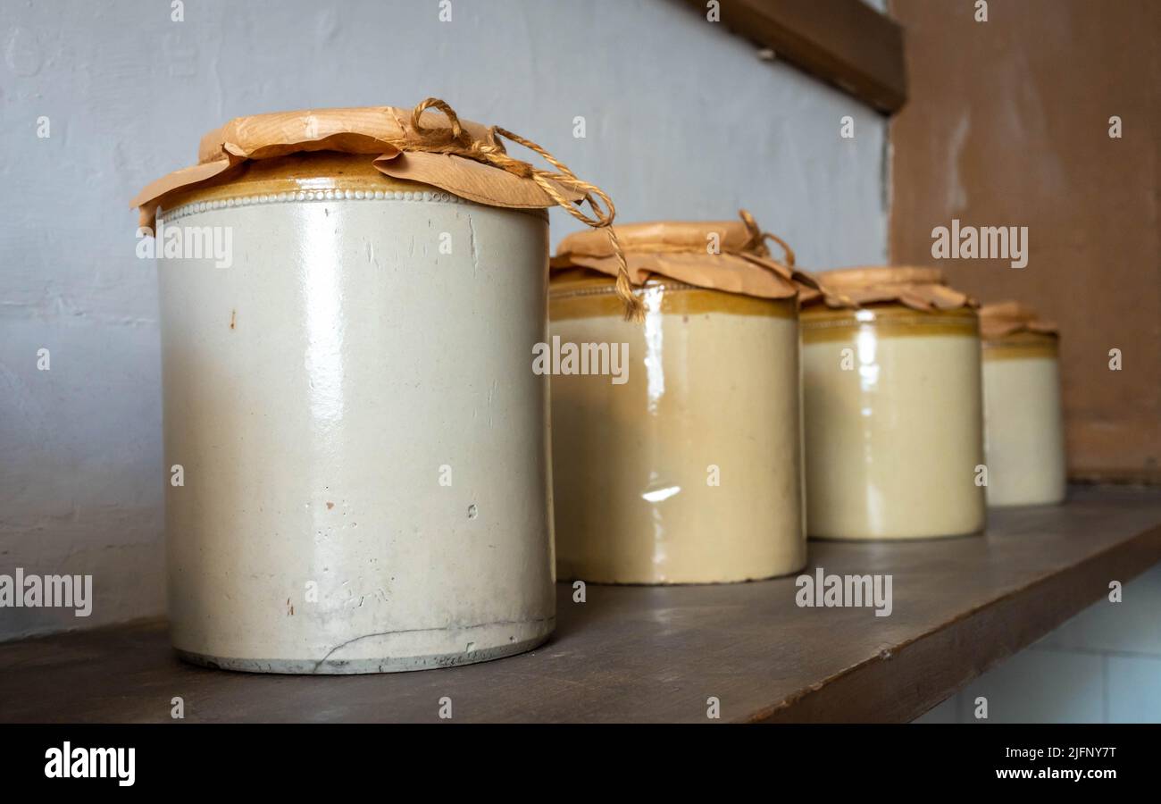 Old fashioned storage jars on a shelf Stock Photo