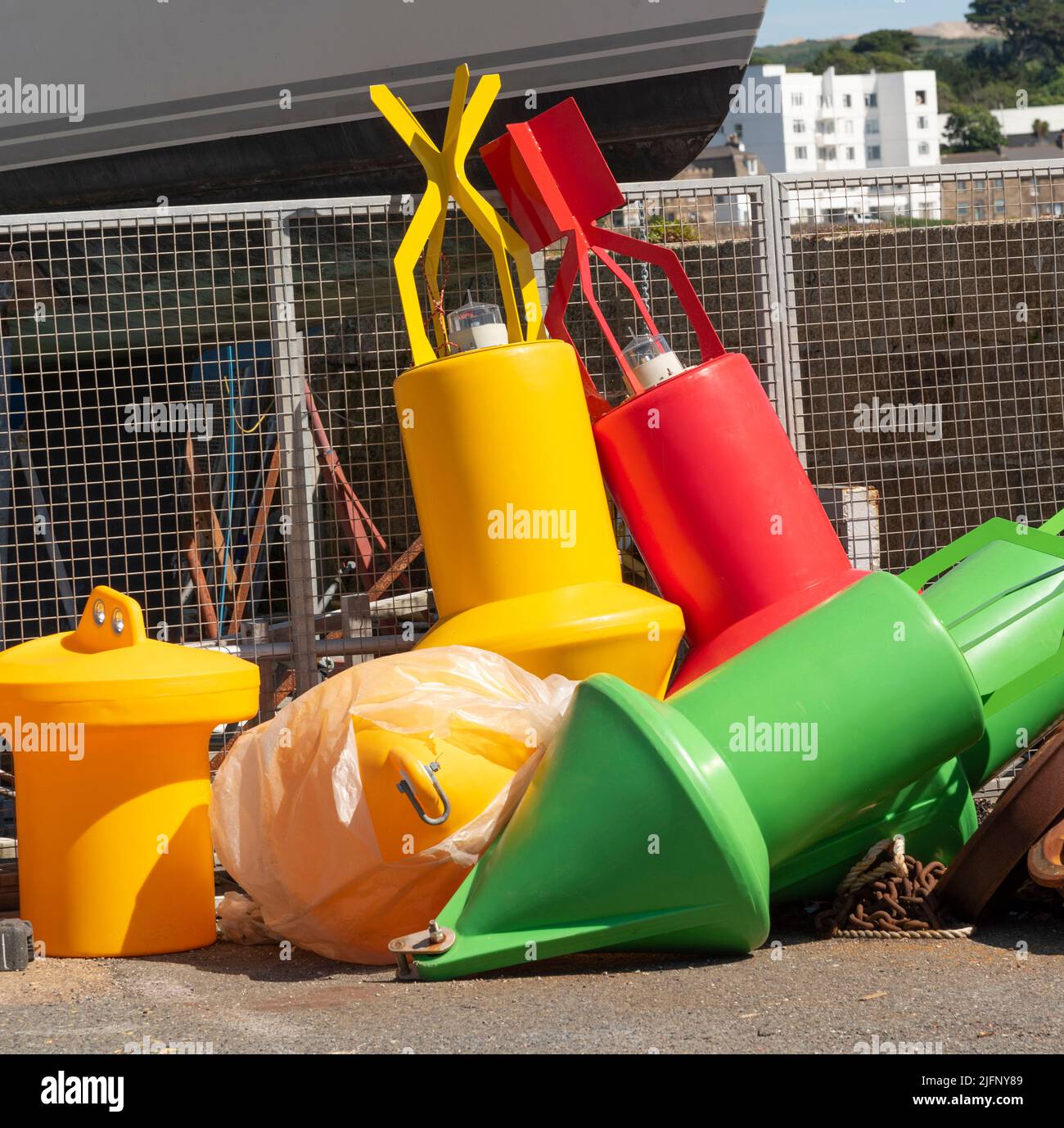 Penzance Harbour, Cornwall, England, UK. 2022. Colourfull selection of plastic buoys for mooring navigation and navigation on the harbour wall. Penzan Stock Photo