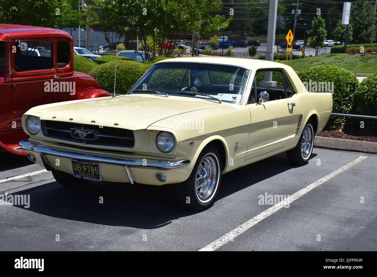 A 1964-1/2 Ford Mustang with a 289 V8 Engine on display at a car show. Stock Photo