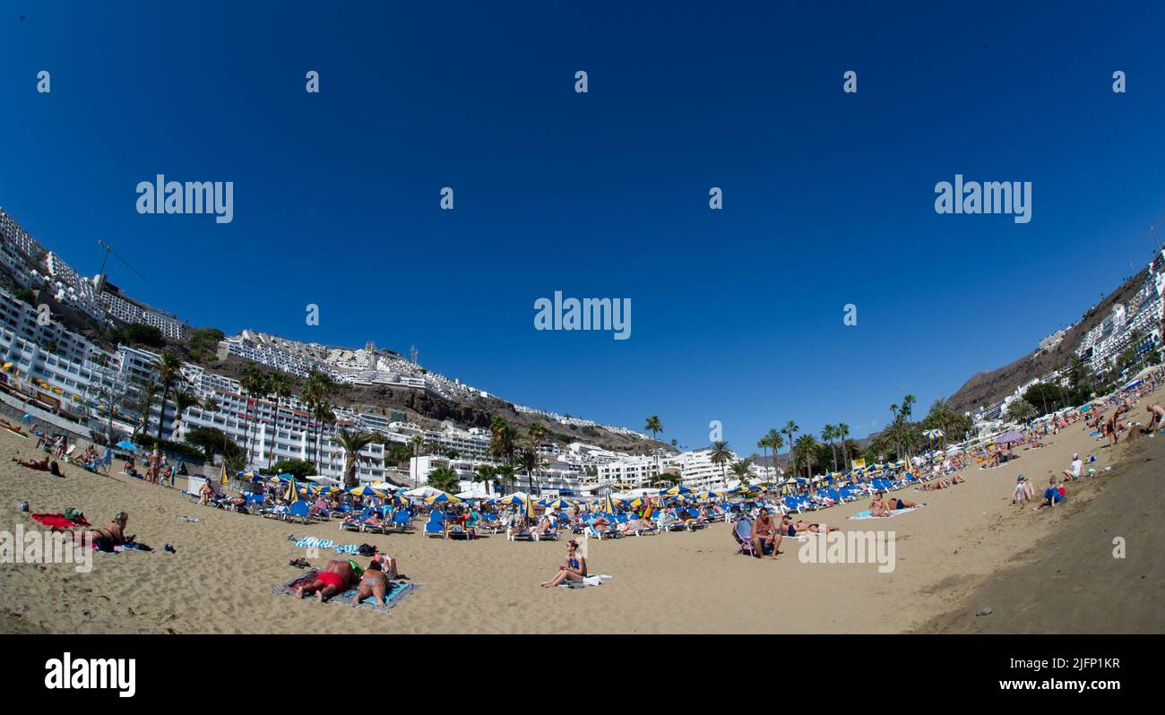 2 February 2022-fish eye lens photo of beautiful beach of Playa de Amadores near Puerto Rico town, Gran Canaria, Canary Islands. Spain Stock Photo