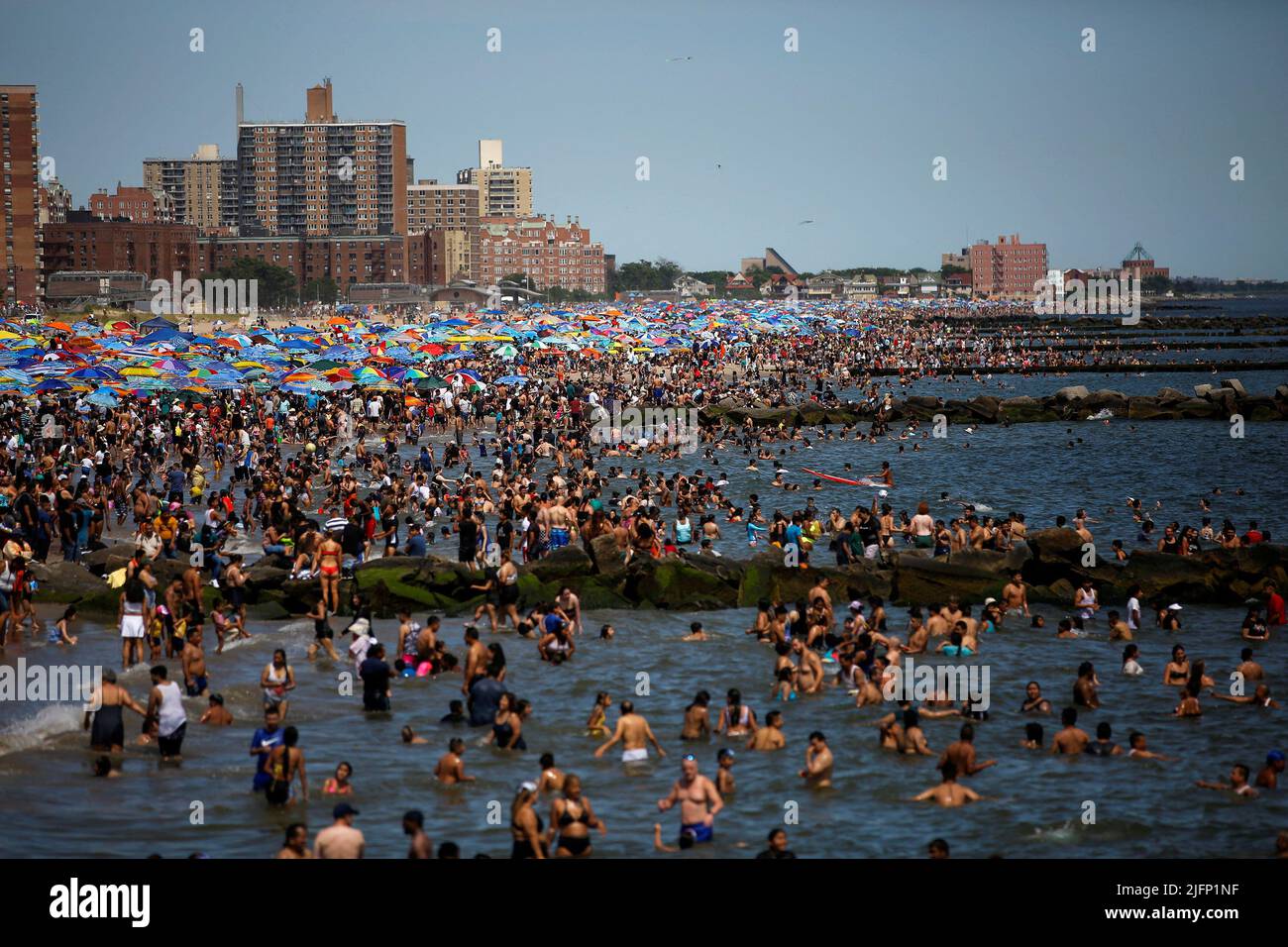 People celebrate 4th of July on an overcrowded beach at Coney Island in New York, U.S., July 4, 2022. REUTERS/Eduardo Munoz Stock Photo