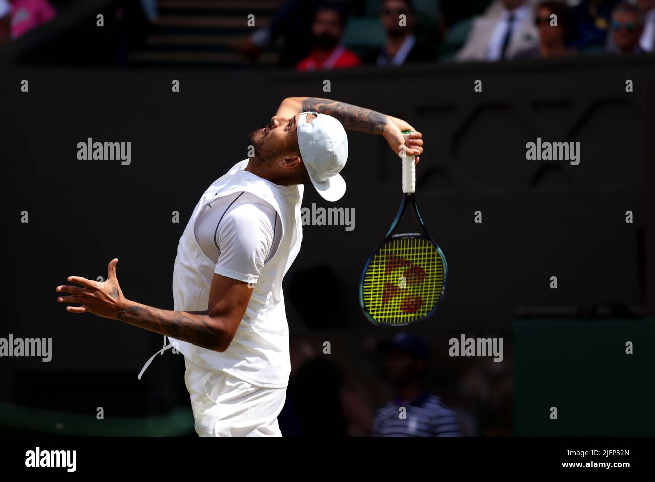 Australia's Nick Kyrigos serving to American Brandon Nakashima during their fourth round match on Center Court today at Wimbledon. Kyrgios won the match in five sets. Credit: Adam Stoltman/Alamy Live News Stock Photo