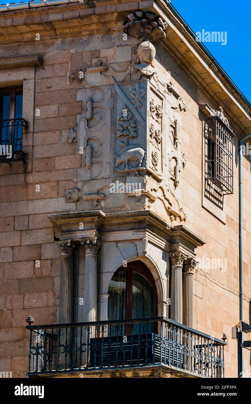 Detail of the balcony and corner coat of arms. Facade of the Casa del Dean and doctor Trujillo. Plasencia, Cáceres, Extremadura, Spain, Europe Stock Photo