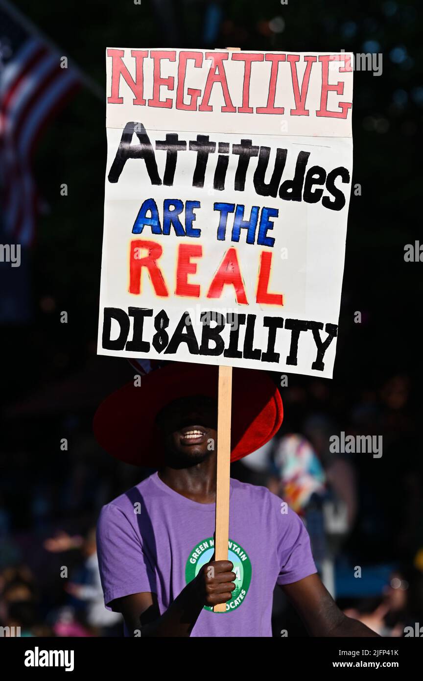Marcher marching in favor of changing attitudes toward disabled people, Montpelier, VT, USA, July 4 parade. Stock Photo