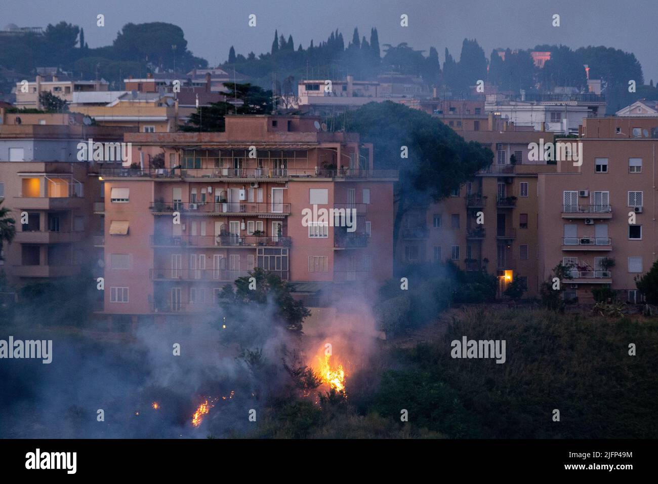 Rome, Italy. 04th July, 2022. Flames lick some buildings in Balduina ...
