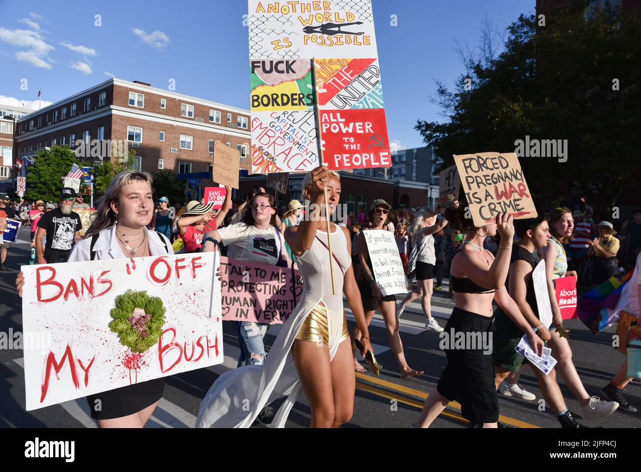 Abortion rights advocates carrying abortion rights signs march in the Montpelier, VT, USA, July 4 parade. Stock Photo