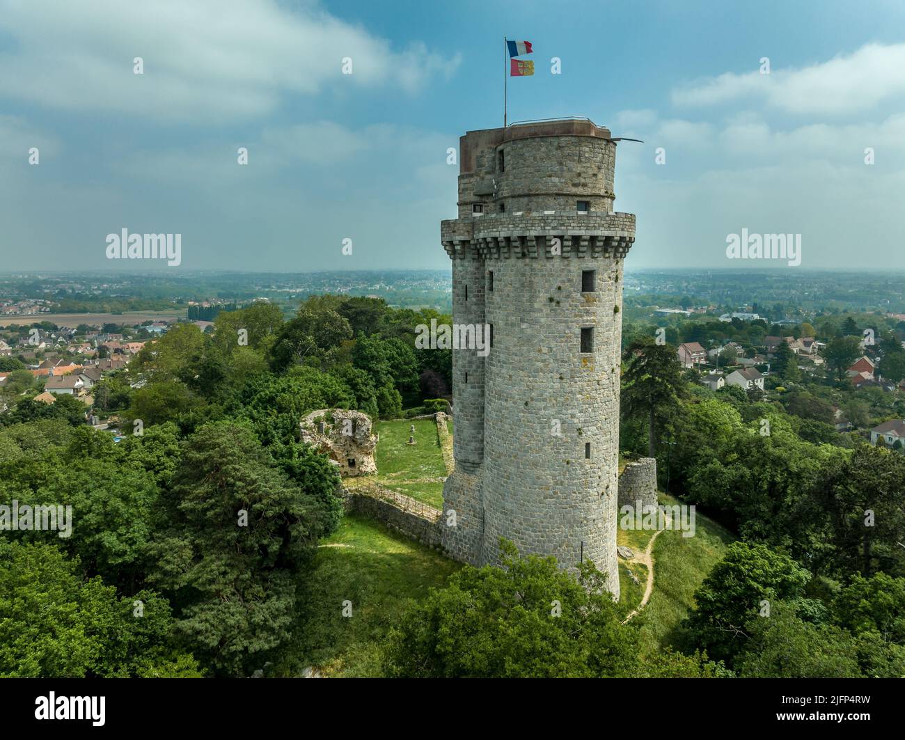 Aerial view of medieval ruined Montlhéry castle controlling the Paris - Orleans road with prominent keep towering over the hill in Central France Stock Photo