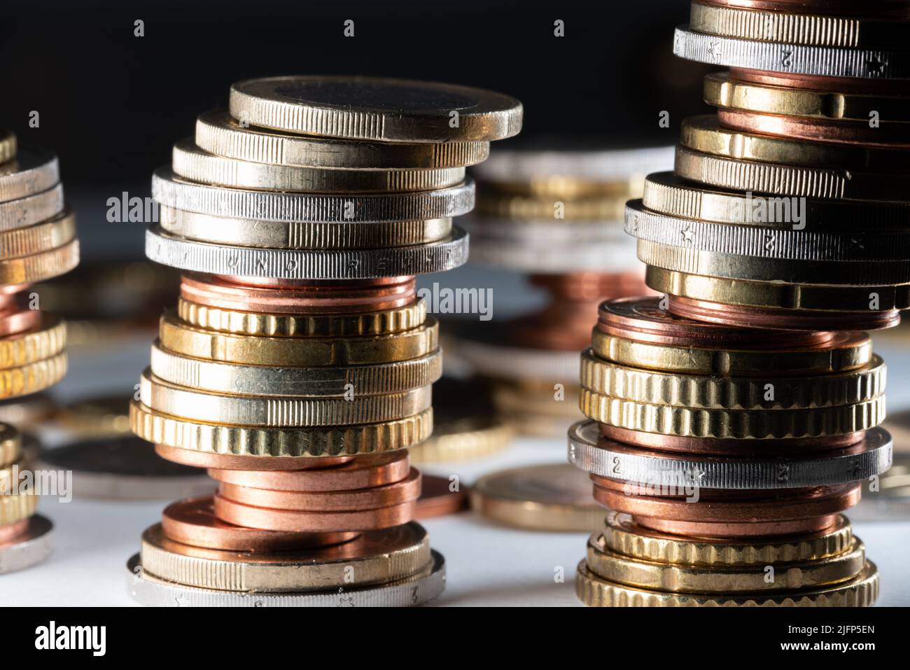 piled up Euro. Stacked coins in different sizes and positions Stock ...