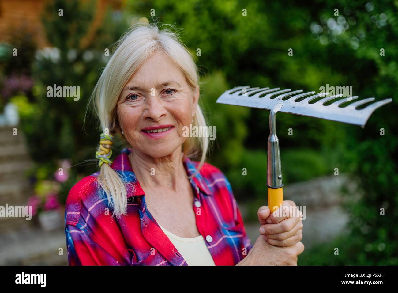 Portrait farmer holding rake hi-res stock photography and images - Alamy
