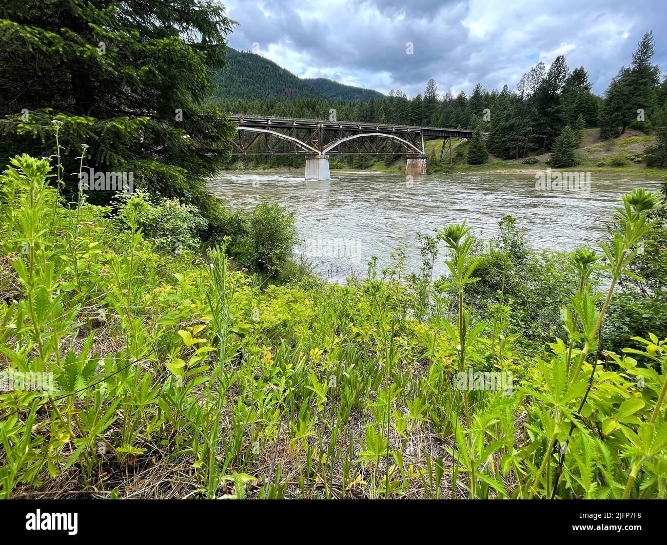 St. Regis, Montana, USA. 20th June, 2022. (EDITORS NOTE: This image was shot with an iPhone.) A railroad bridge is seen crossing over the Clark Fork River near St. Regis, Montana on June 20, 2022. (Credit Image: © David Becker/ZUMA Press Wire) Stock Photo