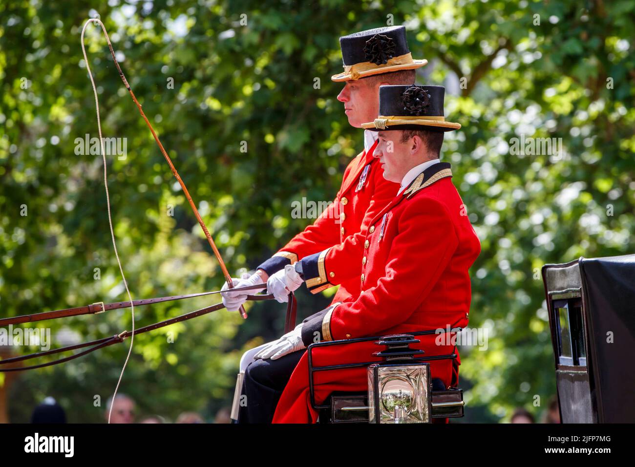 Two grooms riding a carriage at Trooping the Colour, Colonel’s Review in The Mall, London, England, United Kingdom on Saturday, May 28, 2022. Stock Photo