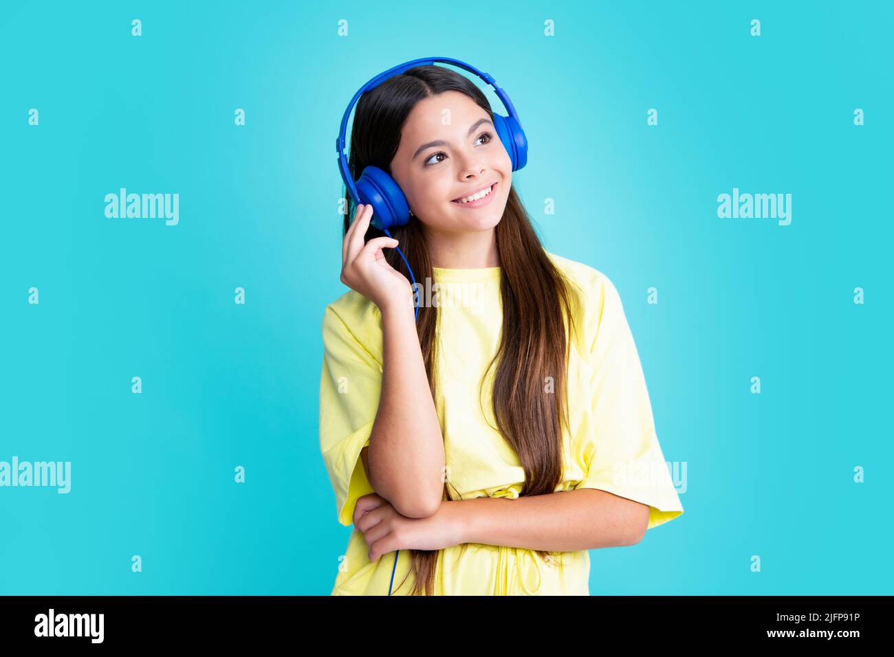 Beautiful teenage girl wearing earphones hi res stock photography