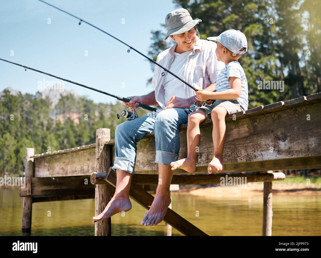 Boy fishing grandpa hi-res stock photography and images - Alamy