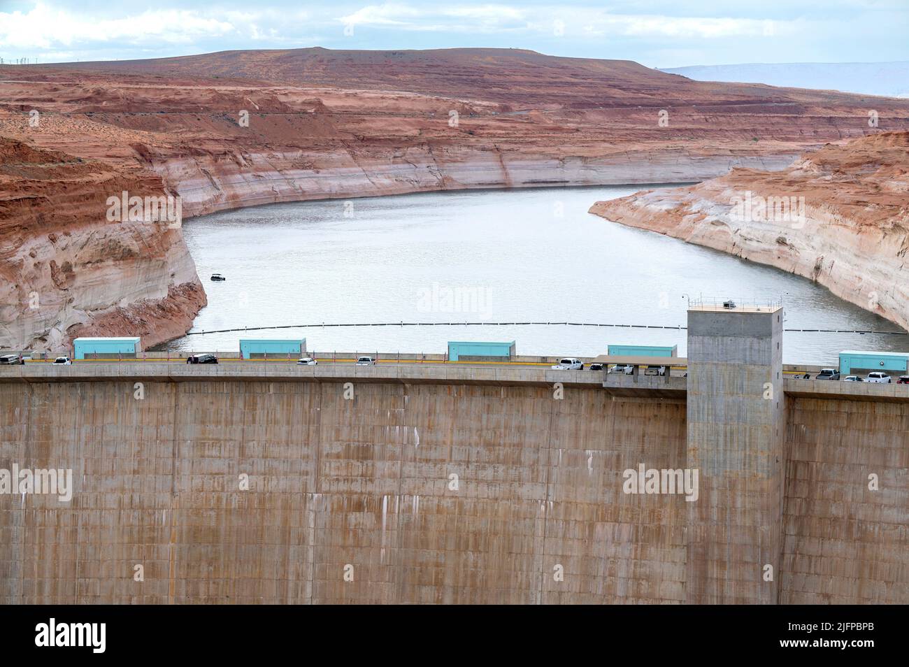 Page, Arizona, USA. 30th June, 2022. A view of the Glen Canyon Dam at Lake Powell on June 30, 2022 in Page, Arizona. As severe drought grips parts of the Western United States, water levels at Lake Powell have dropped to their lowest level since the lake was created by damming the Colorado River in 1963. The Colorado River Basin connects Lake Powell and Lake Mead and supplies water to 40 million people in seven western states. (Credit Image: © David Becker/ZUMA Press Wire) Stock Photo