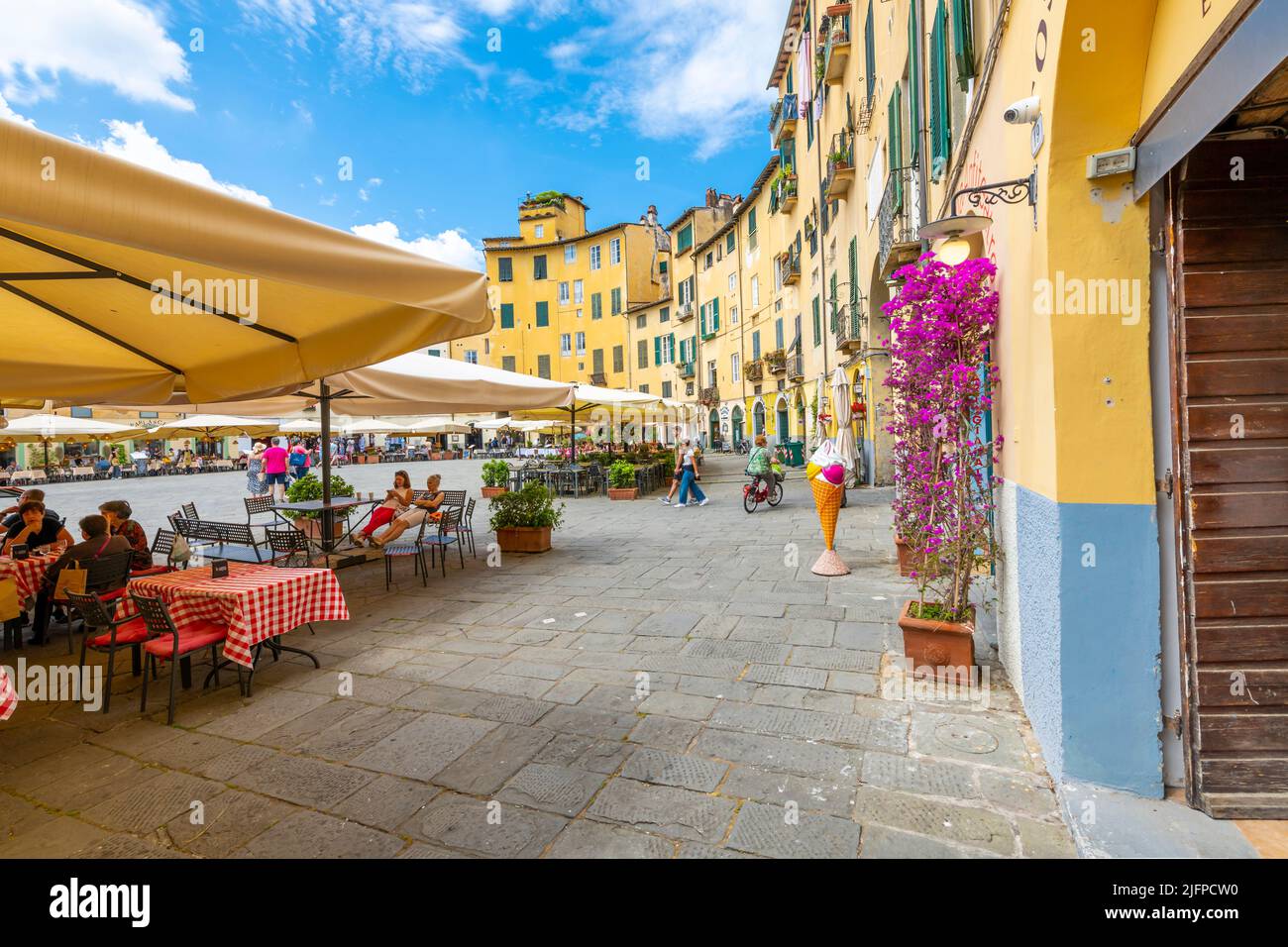 The ancient amphitheater, now a gathering place with cafes and shops, the Piazza del Anfiteatro, in the Tuscan walled town of Lucca, Italy. Stock Photo