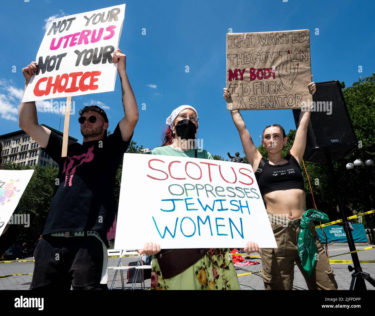 New York, United States. 04th July, 2022. People hold signs saying 'Not your uterus, not your choice', 'SCOTUS oppresses Jewish women' and 'If I wanted the gov't in my body then I'd f**k a Senator' at an abortion rights demonstration in New York City. Credit: SOPA Images Limited/Alamy Live News Stock Photo