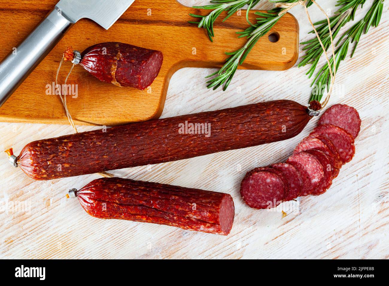 Image of russian smoked sausage cut in slices, close-up Stock Photo