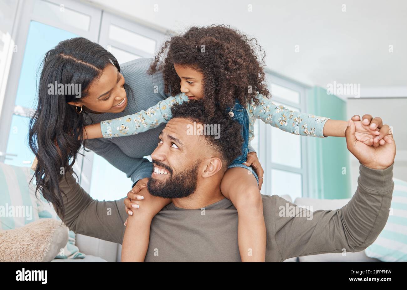 Families are the compass that guides us. Shot of a happy family relaxing together at home. Stock Photo