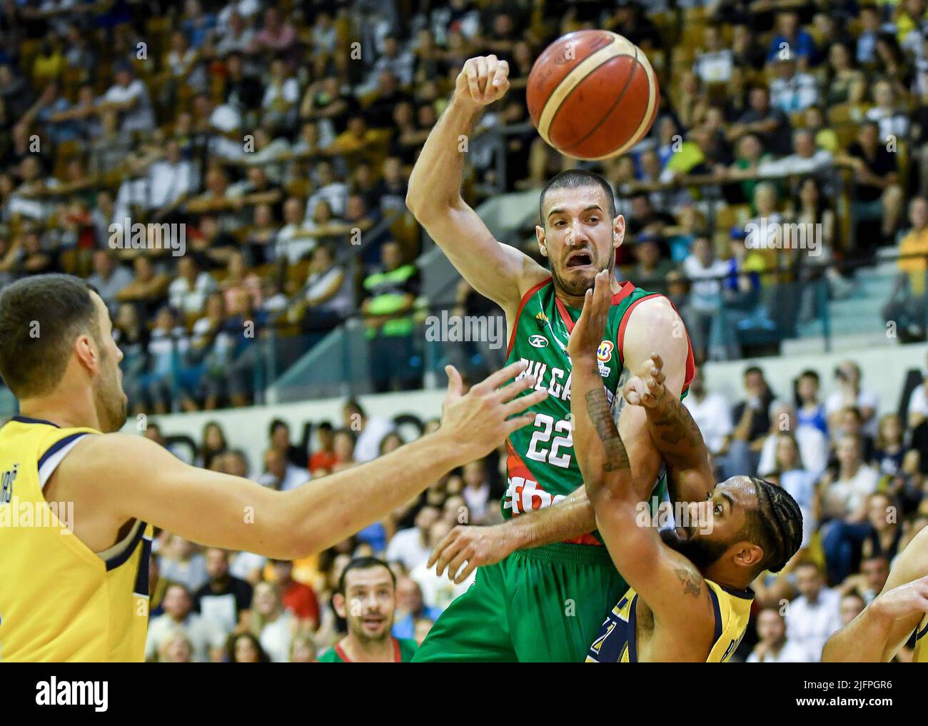 Sarajevo, Bosnia and Herzegovina. 4th July, 2022. Pavlin Ivanov (2nd R) of Bulgaria passes the ball during the 1st round match of Group F at FIBA World Cup European Qualifiers between Bosnia and Herzegovina and Bulgaria in Sarajevo, Bosnia and Herzegovina, on July 4, 2022. Credit: Nedim Grabovica/Xinhua/Alamy Live News Stock Photo