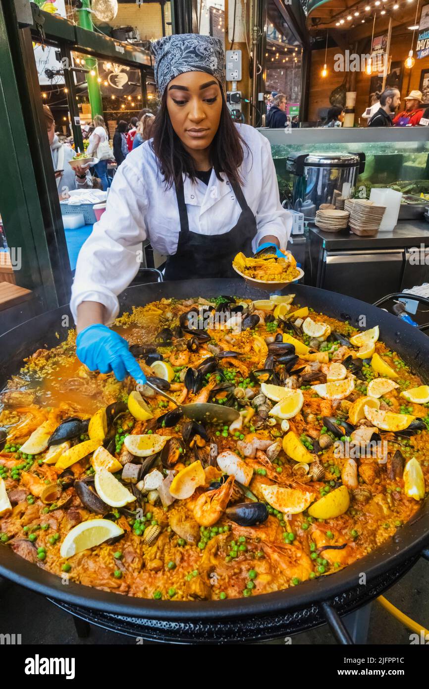 Woman cooking giant paella hires stock photography and images Alamy