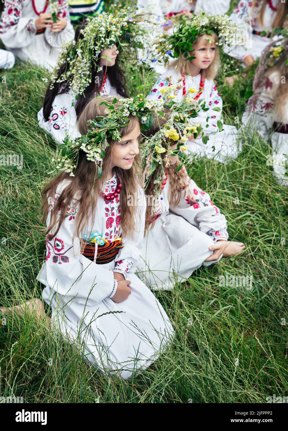 Teenage girls in Ukrainian national clothes and traditional flower