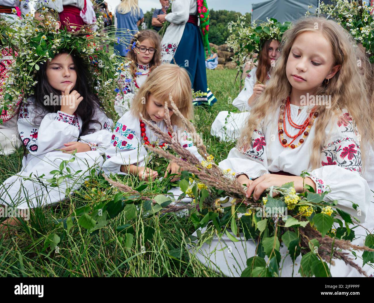 Teenage girls in Ukrainian national clothes and traditional flower