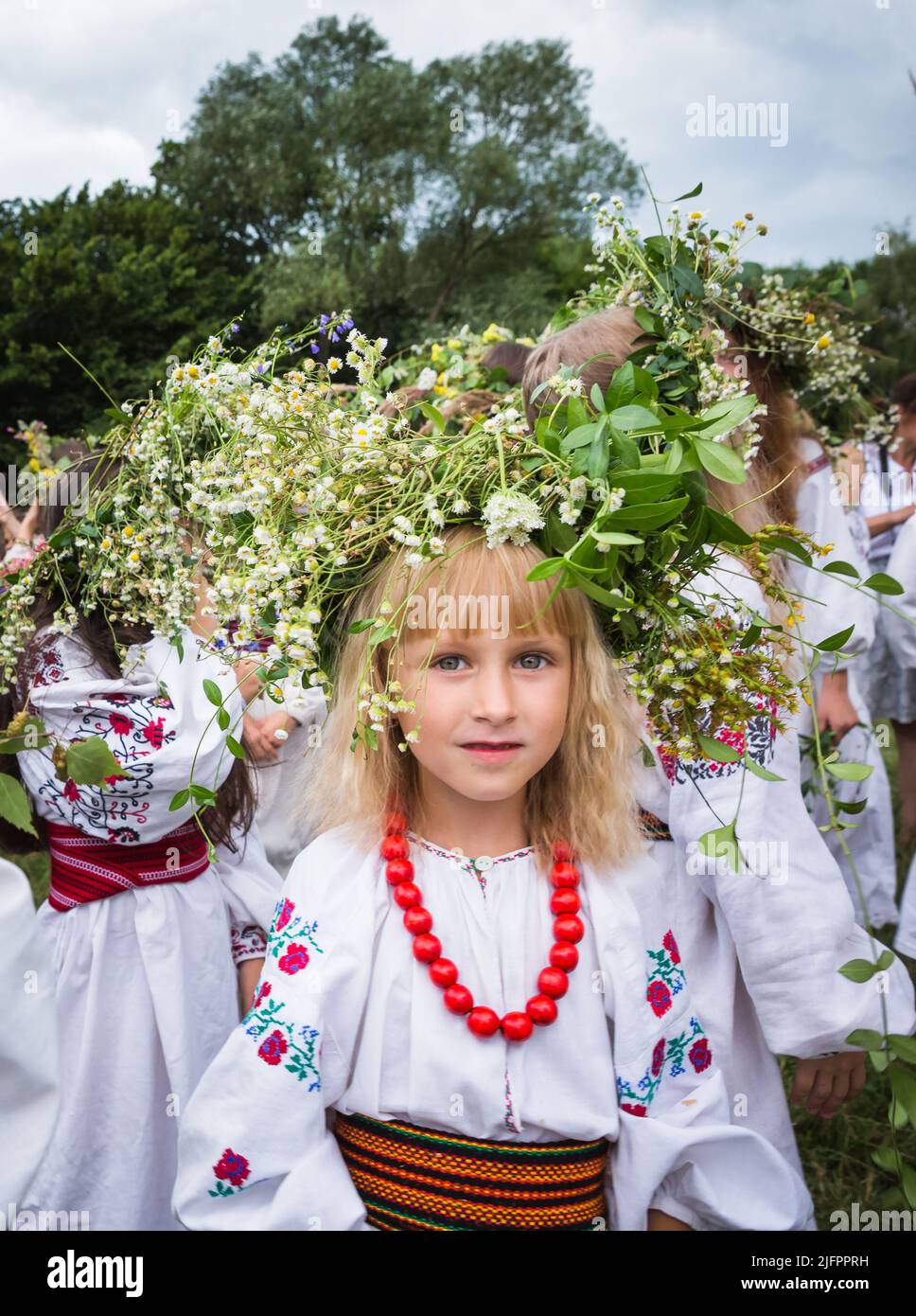 Teenage girls in Ukrainian national clothes and traditional flower