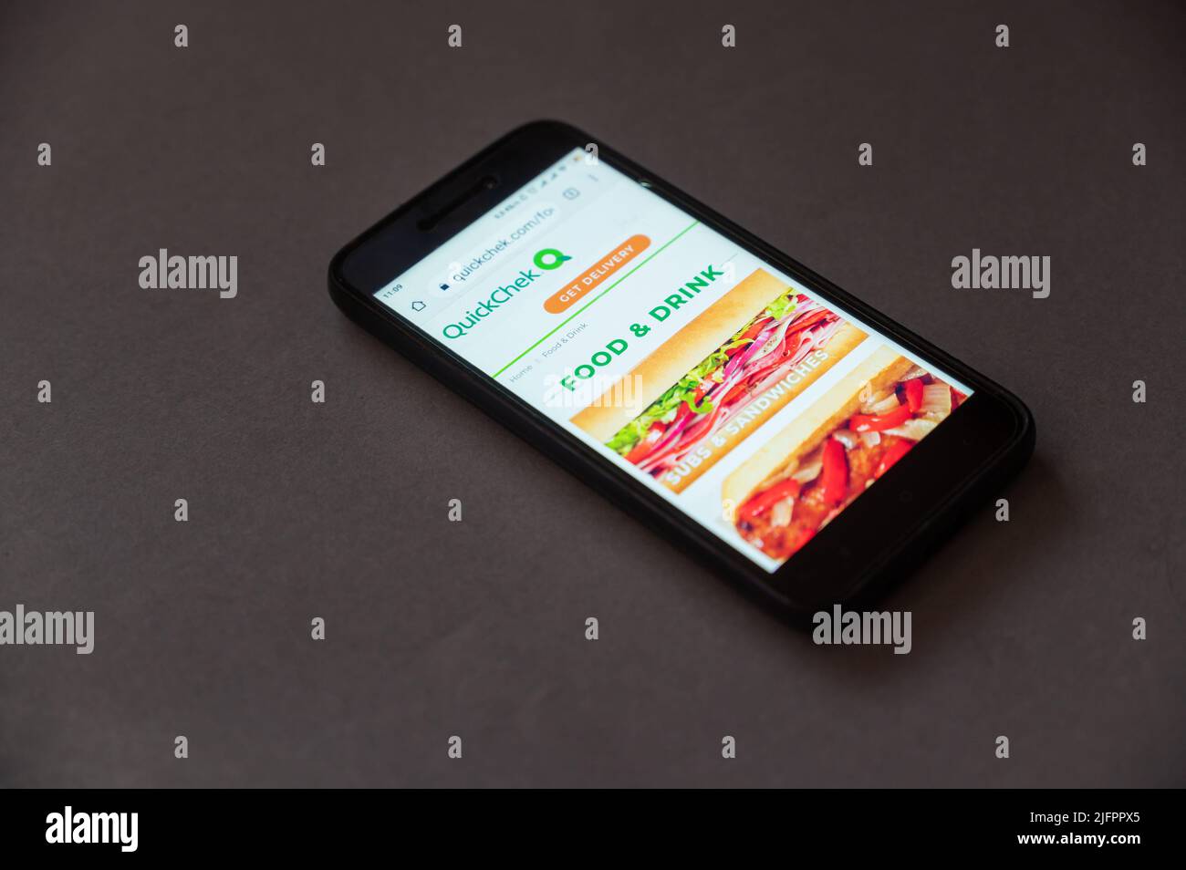 QuickChek website on your smartphone screen. QuickChek is a chain of