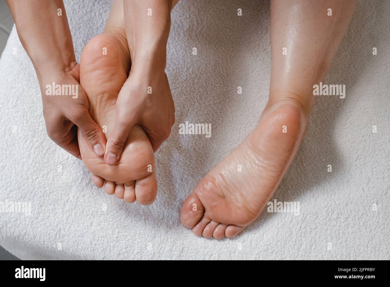 Foot spa massage treatment by professional massage therapist in spa