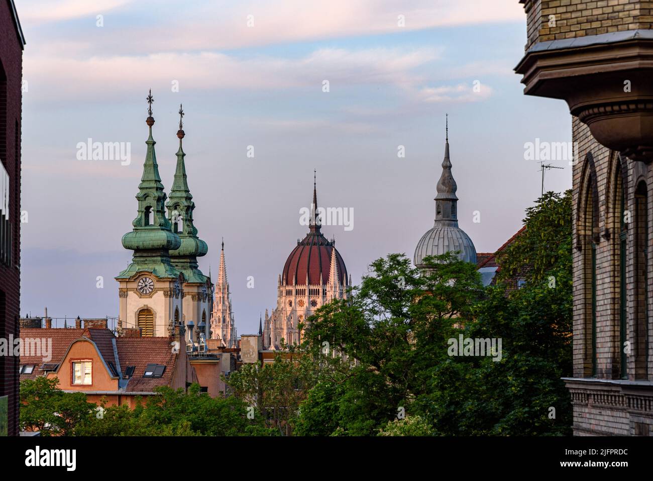 A view of the dome of the Hungarian parliament building and church spires as seen from Buda Stock Photo