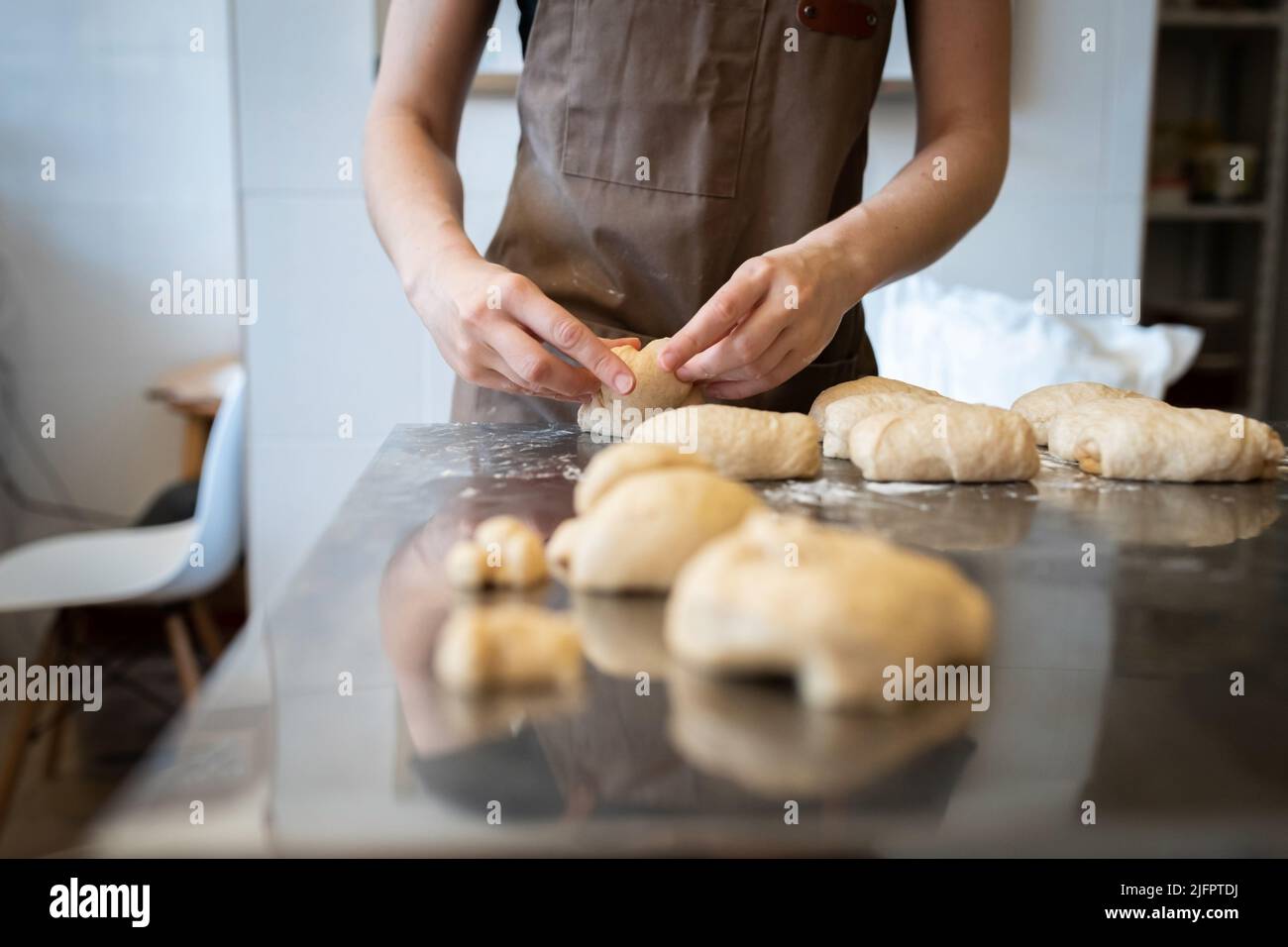 The process of making bread. Dividing the wheat dough into pieces for