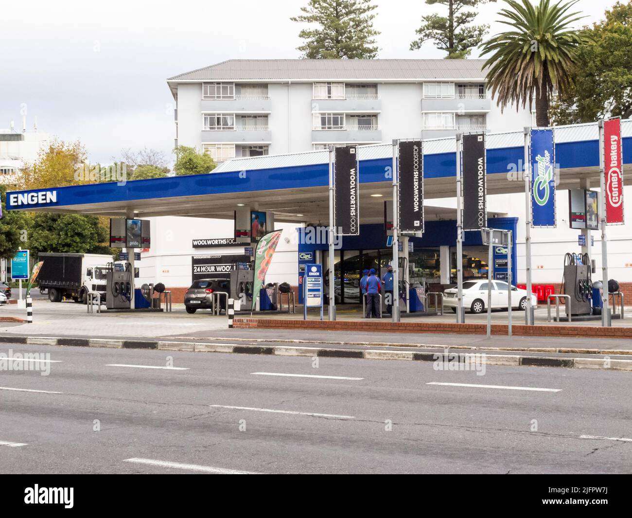 Engen garage forecourt in urban residential area of Cape Town,South Africa showing employees or petrol attendants Stock Photo
