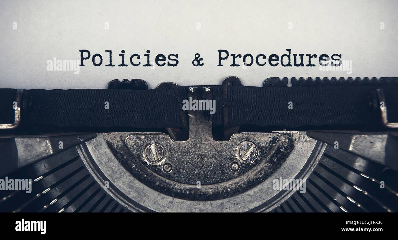 Policies and procedures text typed on an old vintage typewriter. Stock Photo