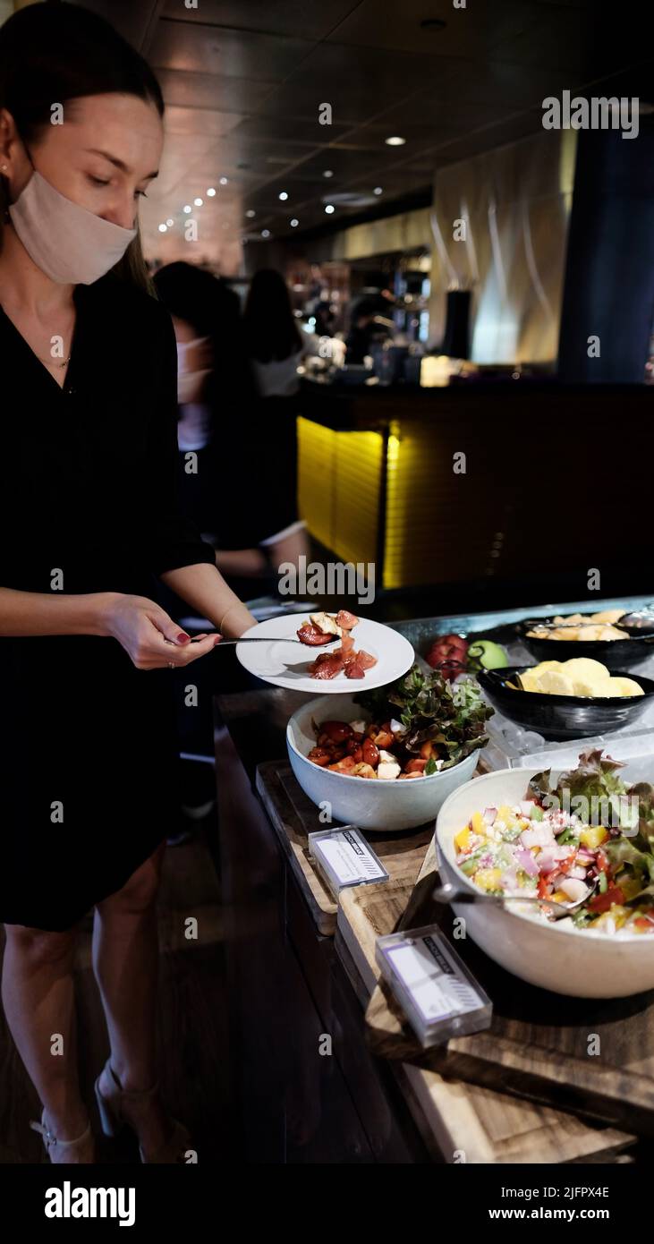 Female Foodie at Buffet Serving Line W Hotel Kitchen Table Restaurant Bangkok Thailand Stock Photo