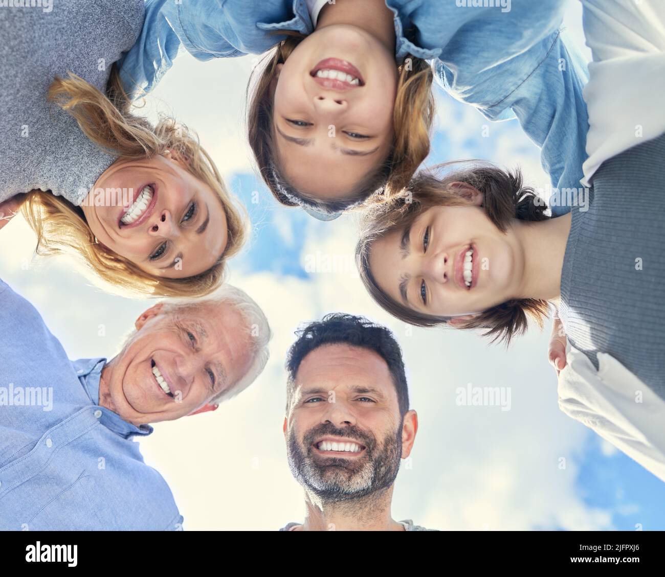 A hug from family lasts a lifetime. Shot of a family huddling together