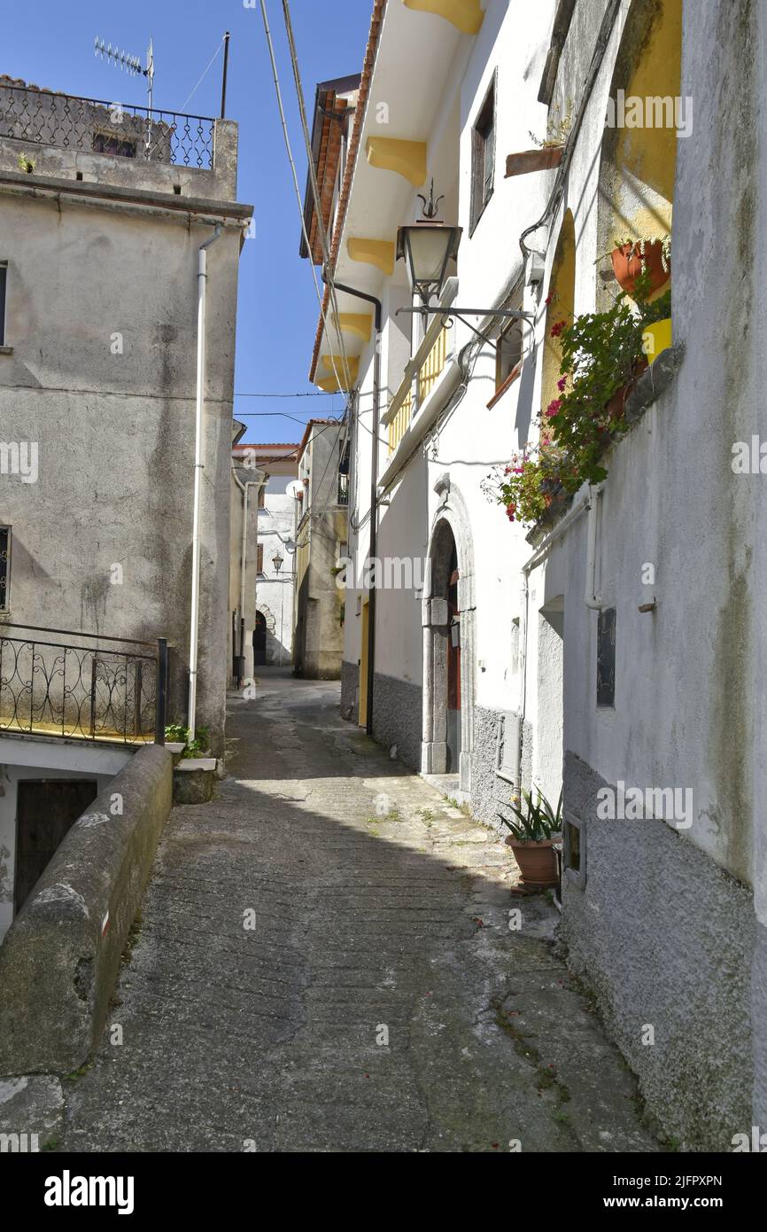 A vertical of a narrow street and old houses in Aieta village, the