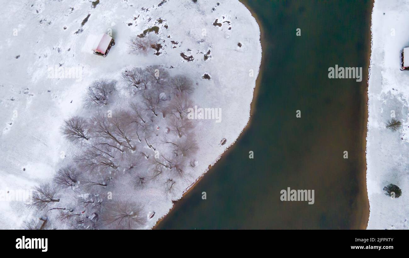 An aerial view of a river surrounded by frozen lands Stock Photo - Alamy