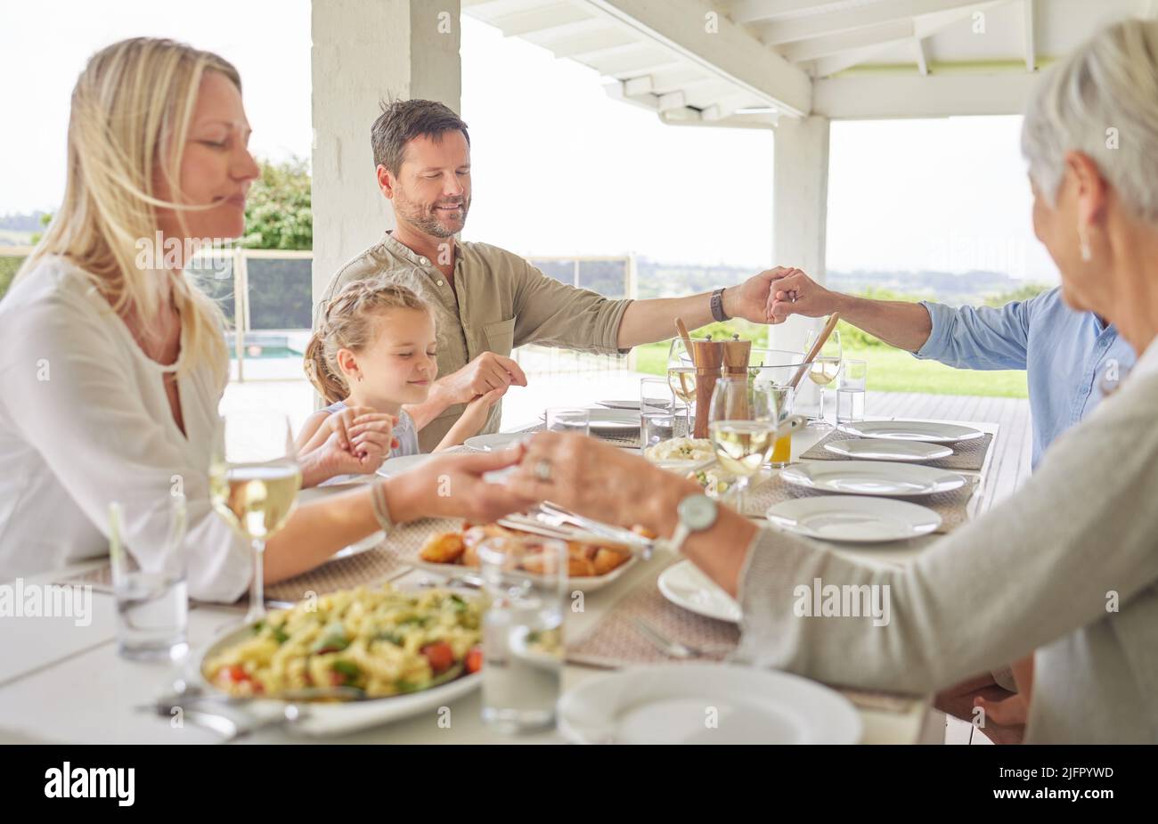 Family praying together hi-res stock photography and images - Alamy