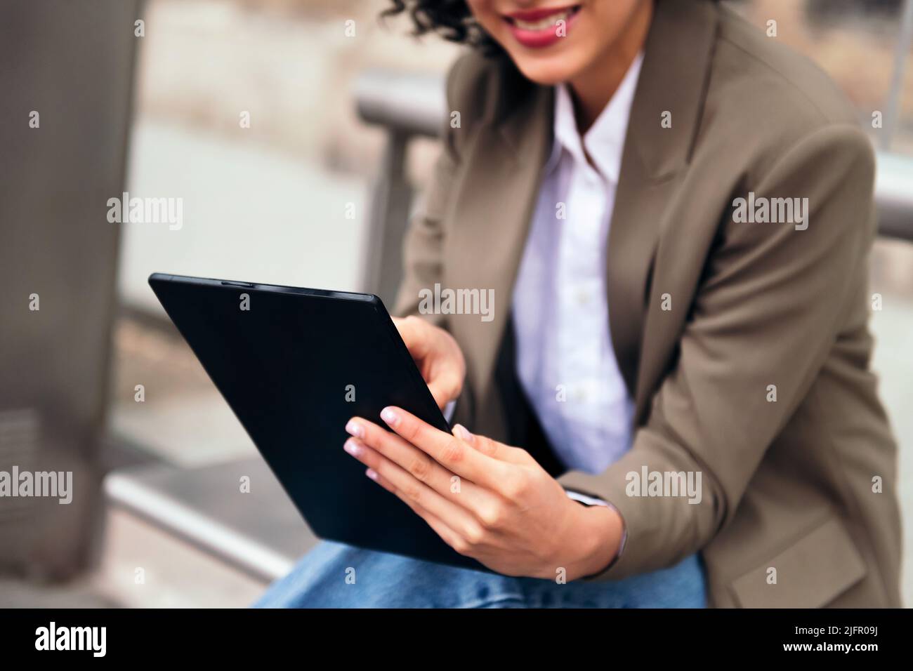 unrecognizable young woman using a tablet Stock Photo