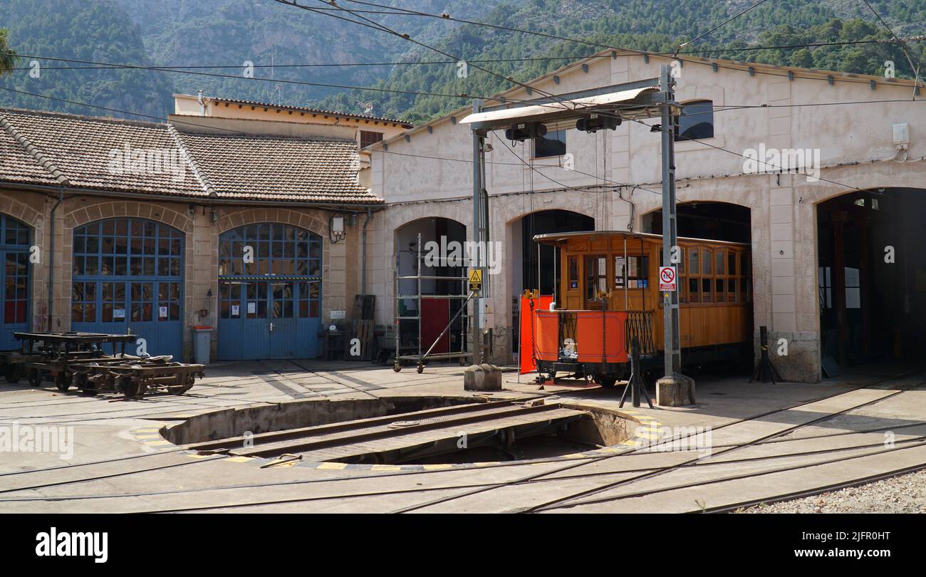 Tram in engine shed with turntable in foreground Soller Mallorca Spain. Stock Photo