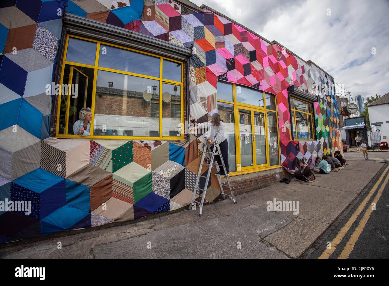 Giant Quilt covered warehouse, Overbury Road, Haringey, London UK Since November 2021 'Quilt Club' have created a quilt big enough to cover a building. Stock Photo