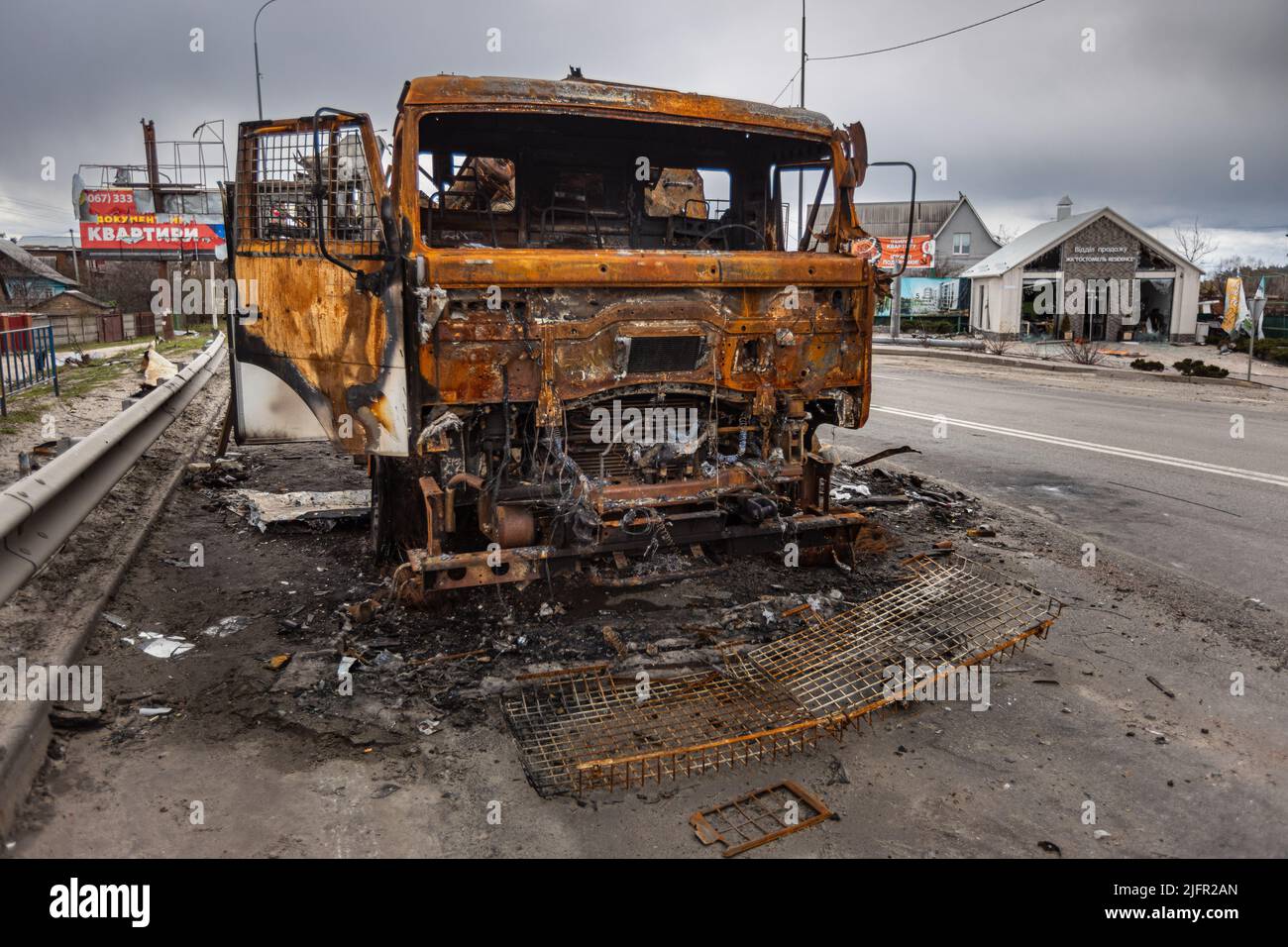 Burnt military vehicles of Russian soldiers on the bridge across the ...