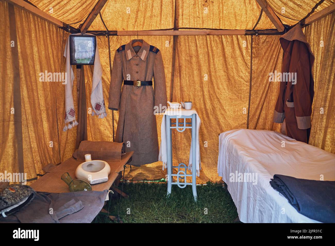An old military field hospital with retro tents and vintage medical beds from the First World