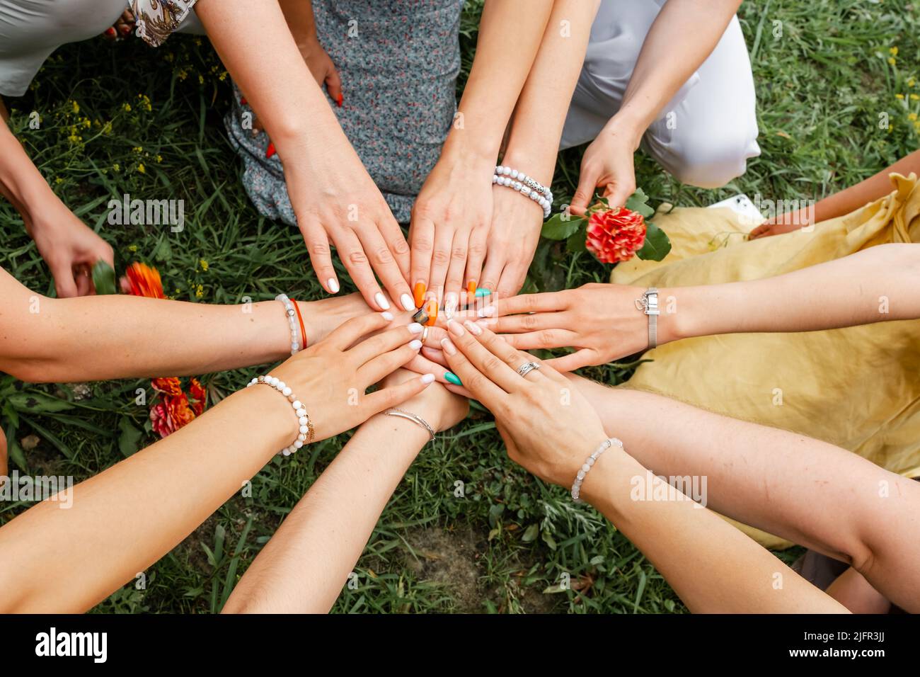 Group of people stacking hands together. Teamwork Stock Photo Alamy
