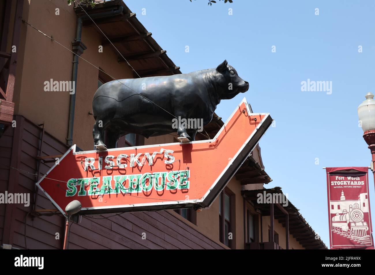 A large pig on a neon sign of Riscky's Steakhouse in Fort Worth, Texas