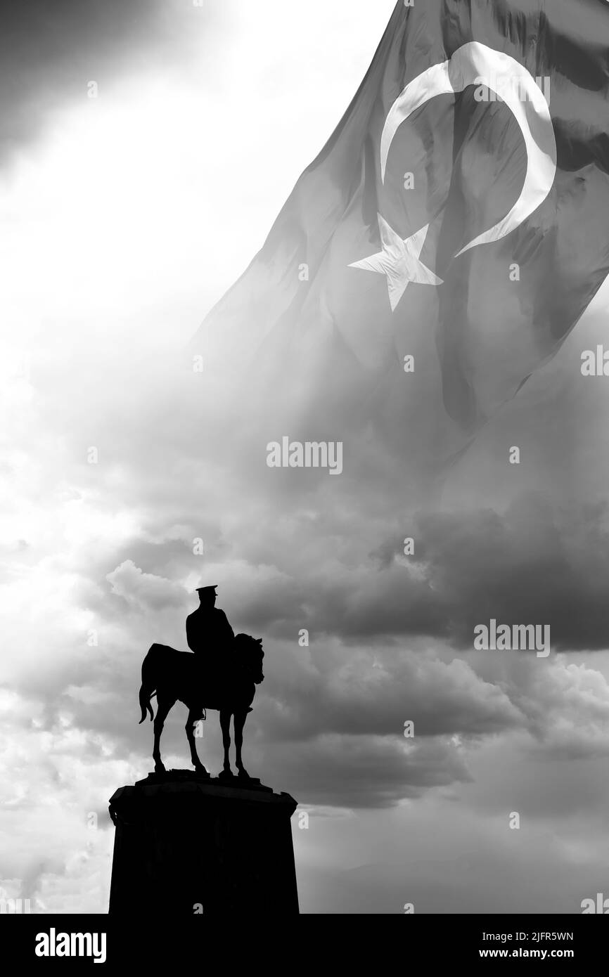 Mustafa Kemal Ataturk Monument and Turkish Flag in black and white view. 10th november or 10 Kasim background vertical photo. Stock Photo